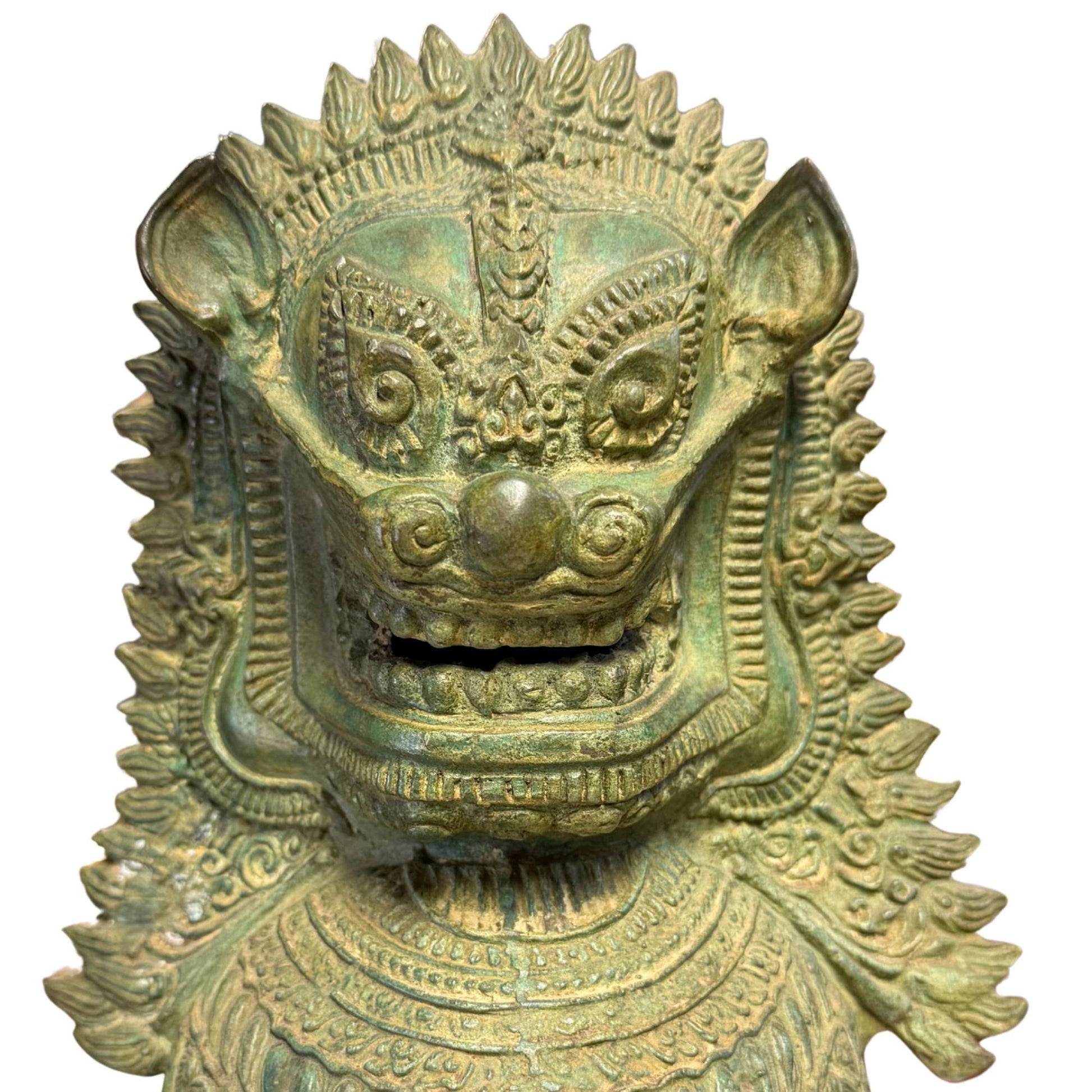 A pair of antique-looking bronze lions as guardians of the threshold at the entrance.