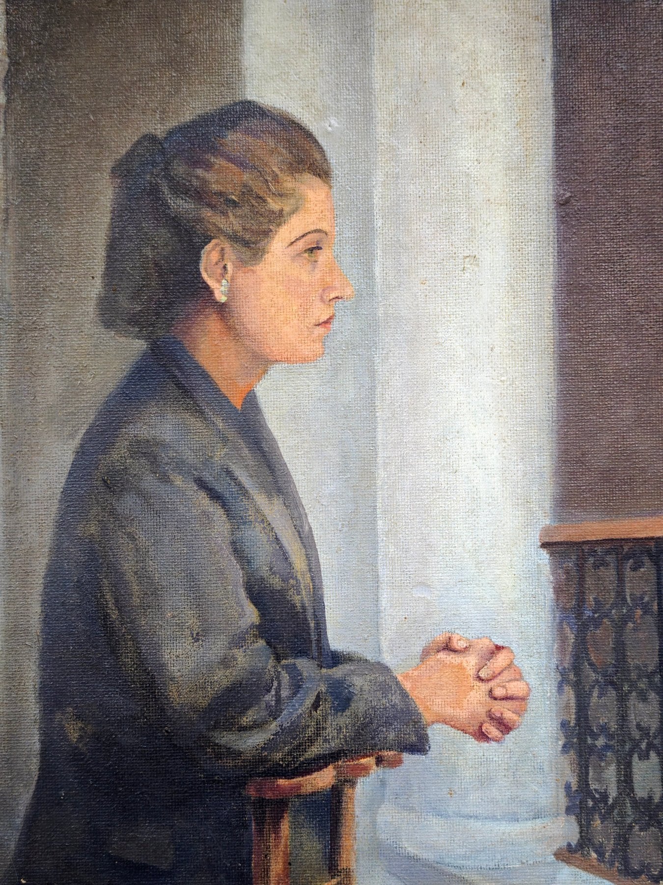 detail woman's hands folded painting restrained posture