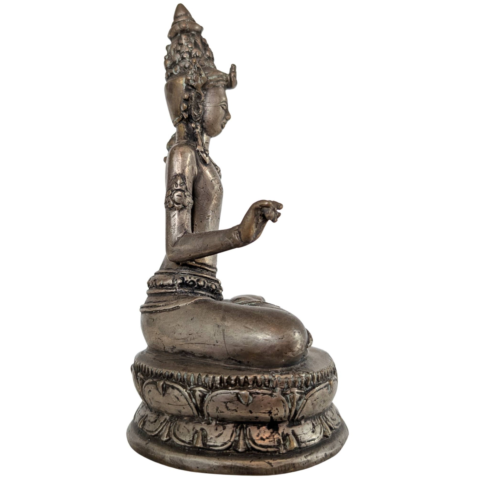 The side view emphasizes the delicate lotus stem growing along the bodhisattva's arm.