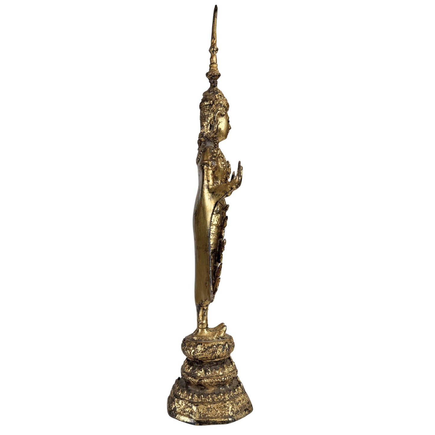 Antique Thai Buddha statue with richly decorated crown and old gilding