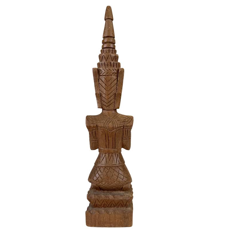 Antique Thai wooden temple guardian statue with fine details