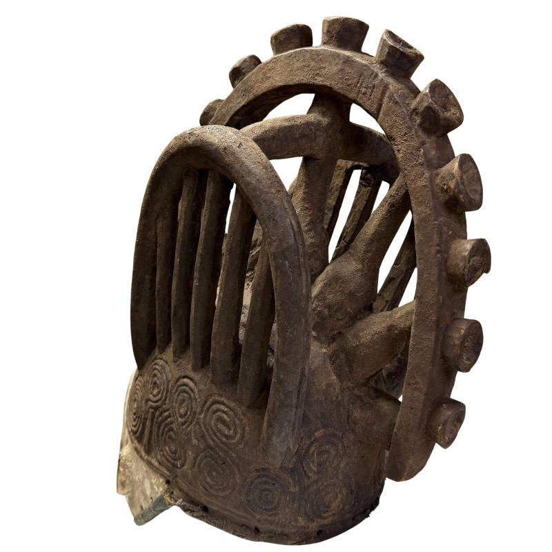Antique tribal mask from Africa, handmade wooden object with old painting and strong decorative presence