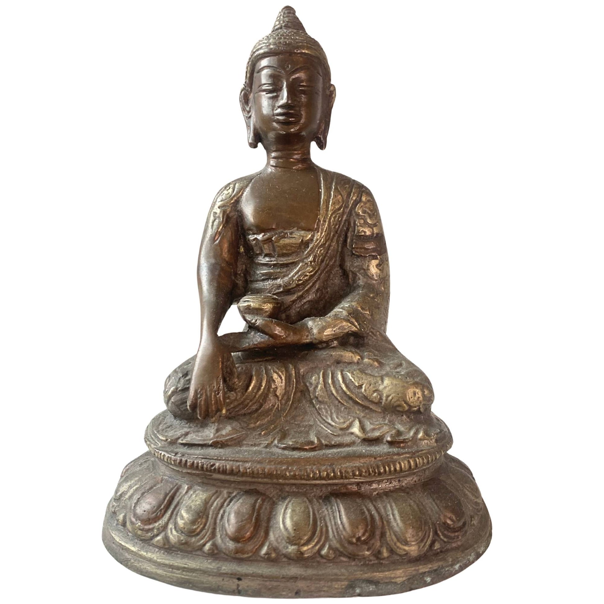 Front view of an antique fire-gilded Burmese bronze Buddha.