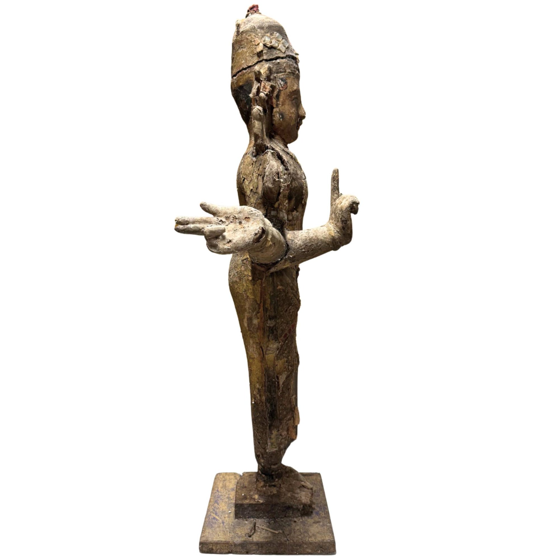 Antique South Indian wooden temple statue with original weathering and sacred appearance