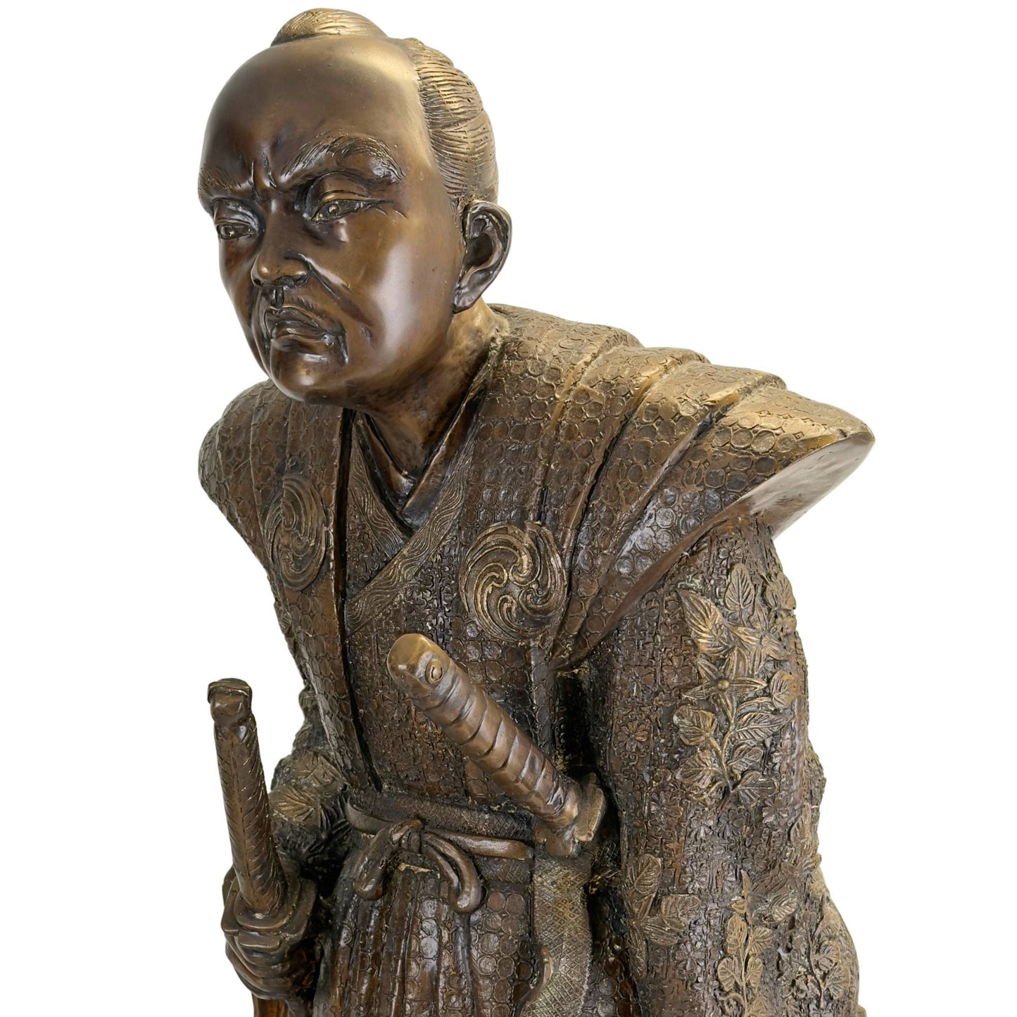 Close-up of the upper body focusing on the crossed collar of the kimono and the Tomoe-mon family crests on the chest.