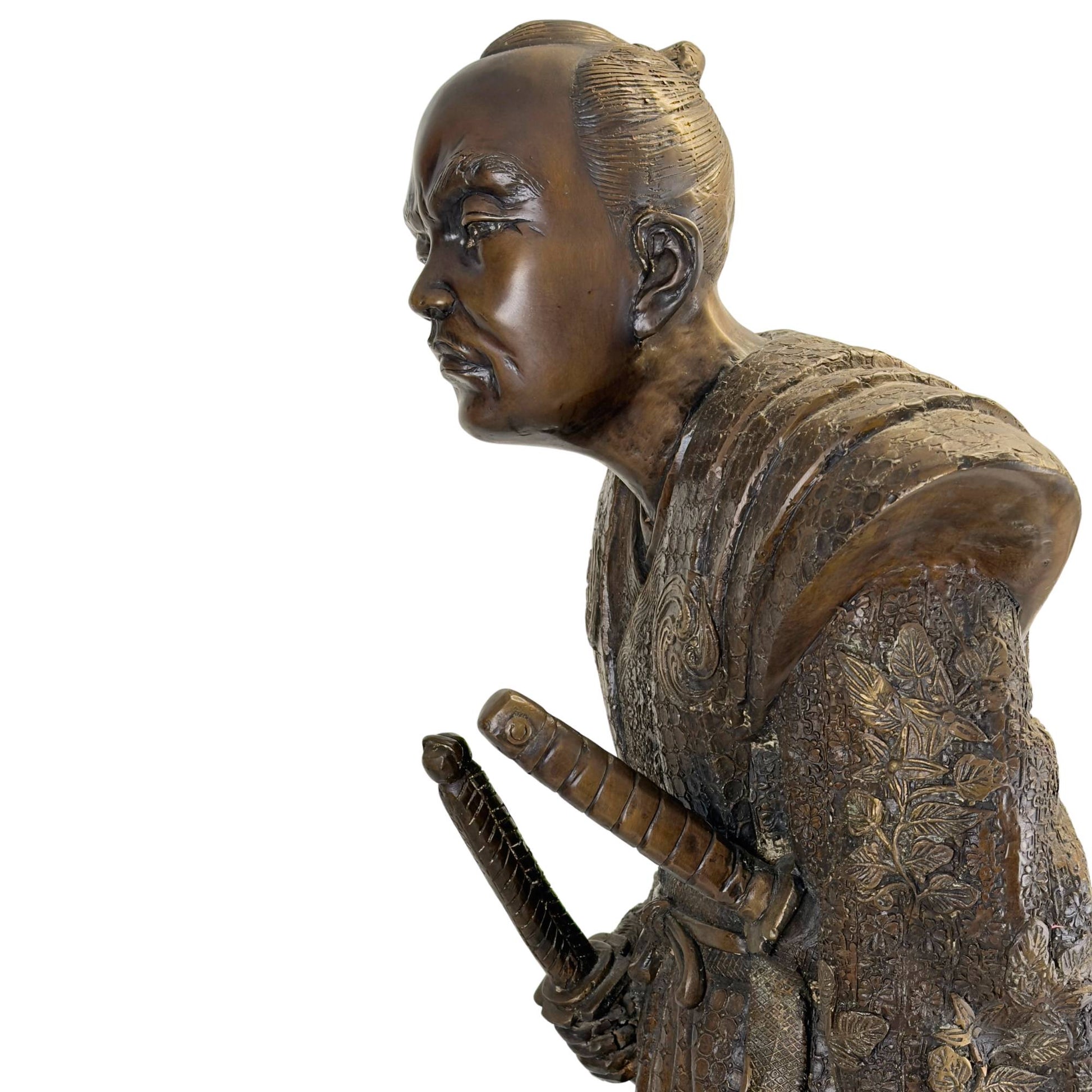 Sharp profile view of the Meiji Samurai accentuating the expressive facial features and the angular line of the Kamishimo shoulder piece.