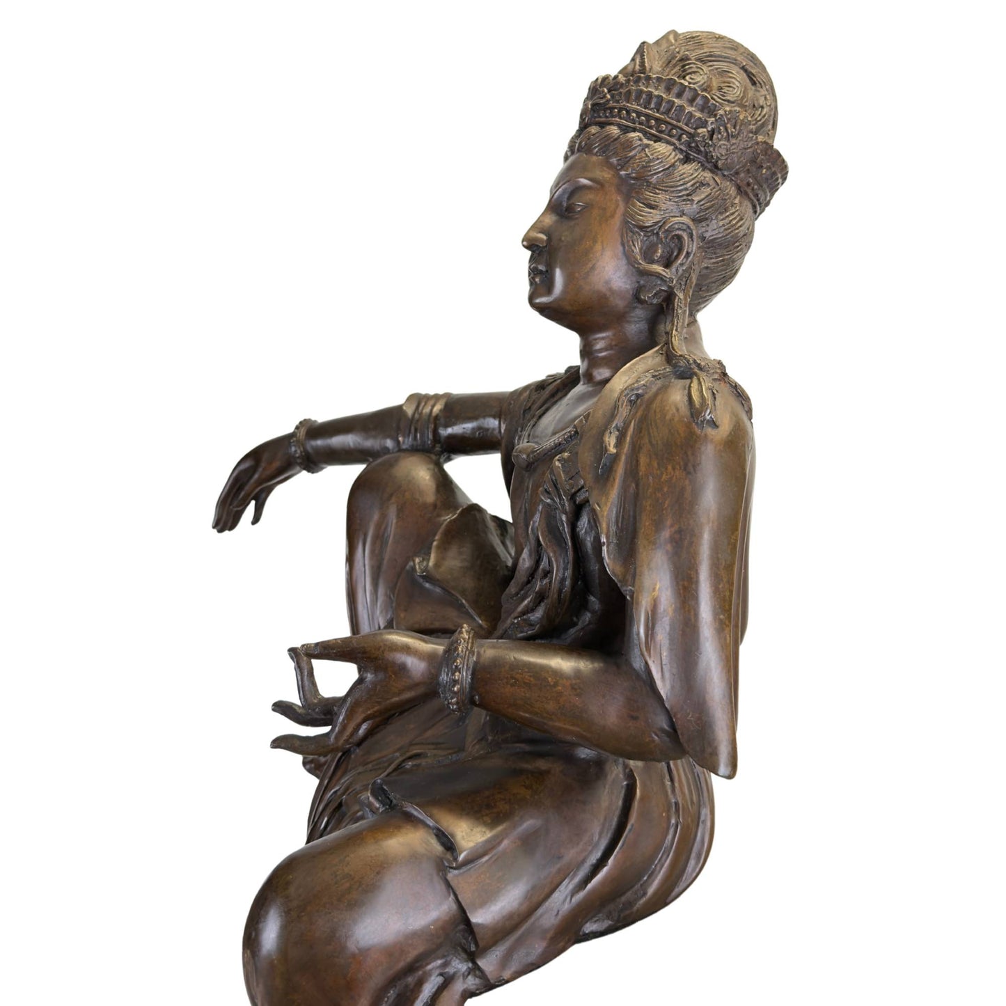 The reverse side of the early 20th-century bronze Guanyin statue with dark oxide tones in the deep folds.