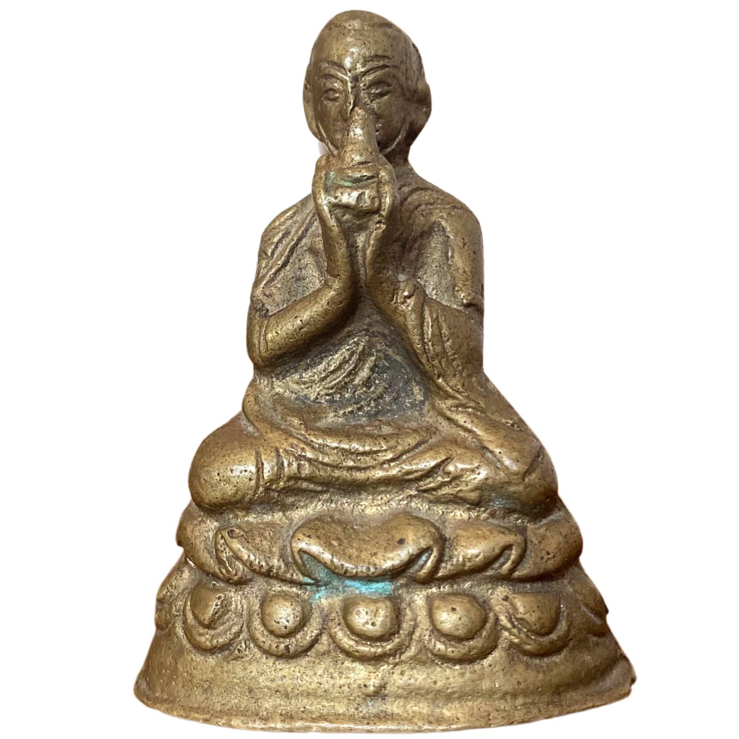 Front view of a seated Mahasiddha or Lama with a unique hand gesture at the mouth.