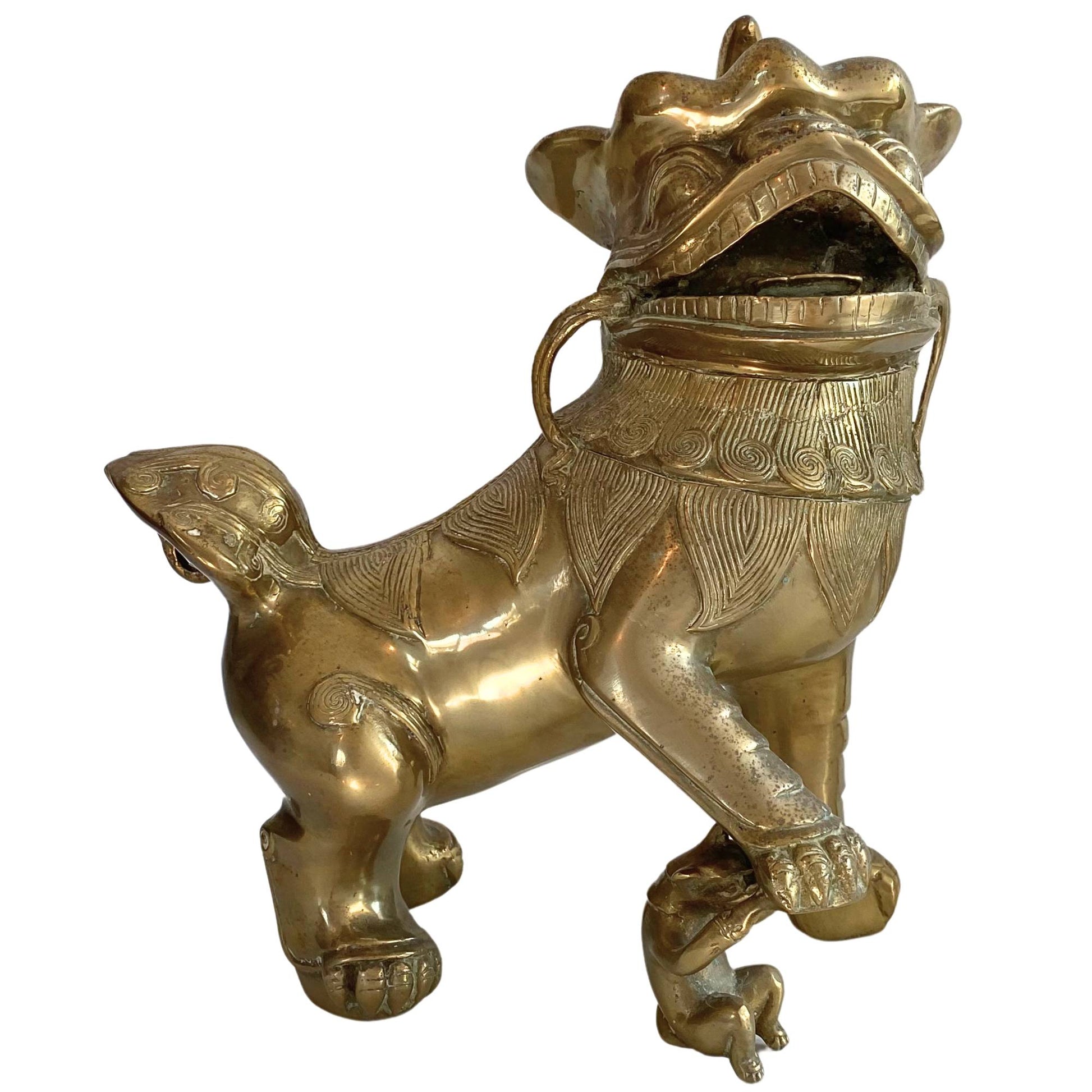 Buy a pair of antique Chinese bronze temple lions, 19th century, fire-gilded