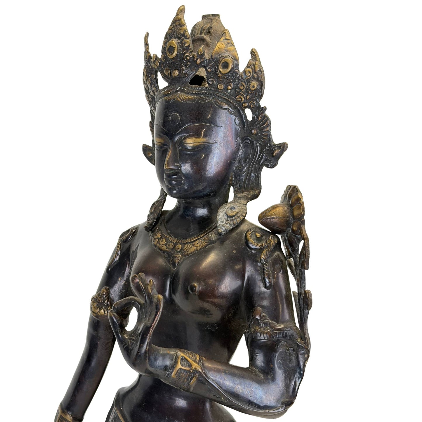 Close-up of the face and bust of an antique bronze Green Tara from the Kathmandu Valley, Nepal, with original fire gilding, black Newar patina, and richly detailed crown.