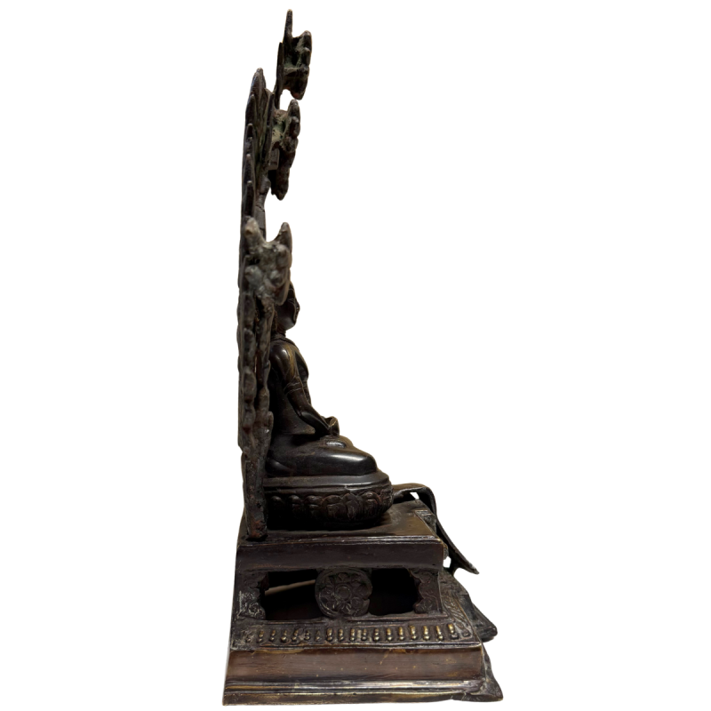 Antique fire-gilded Buddha from the Himalayan tradition with halo