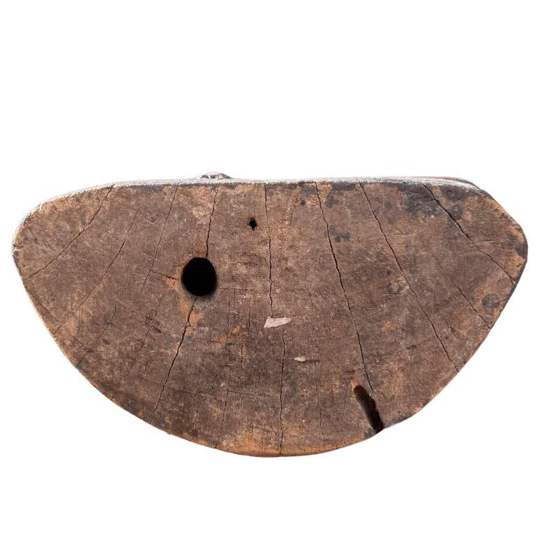 Antique wood grain and annual rings on the underside of the Buddha.