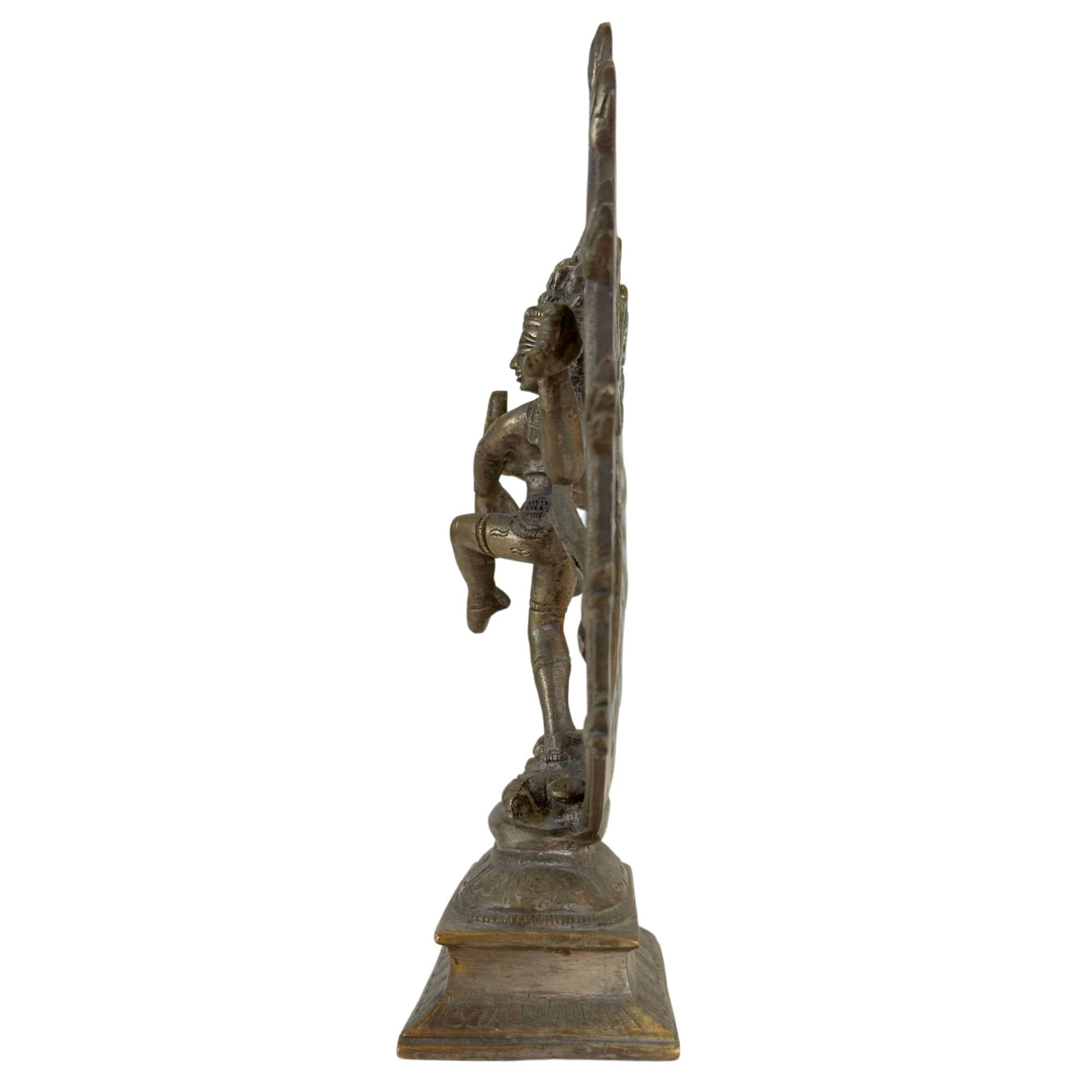Antique Indian bronze Nataraja with decorative halo and flame motifs