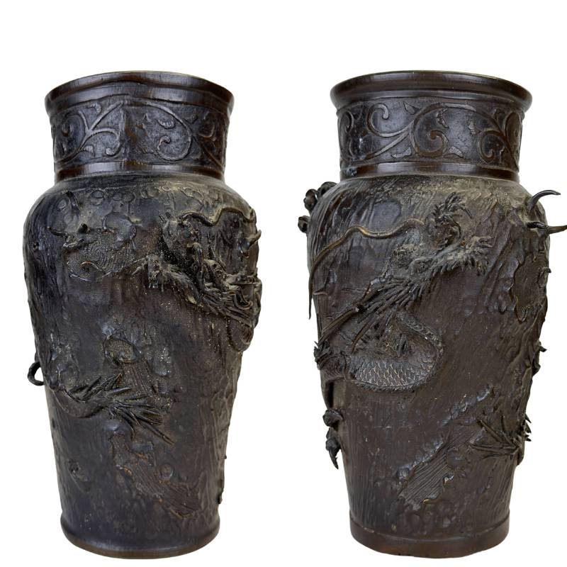 Pair of antique Japanese Meiji vases of heavy Sawari bronze with dragon motif.