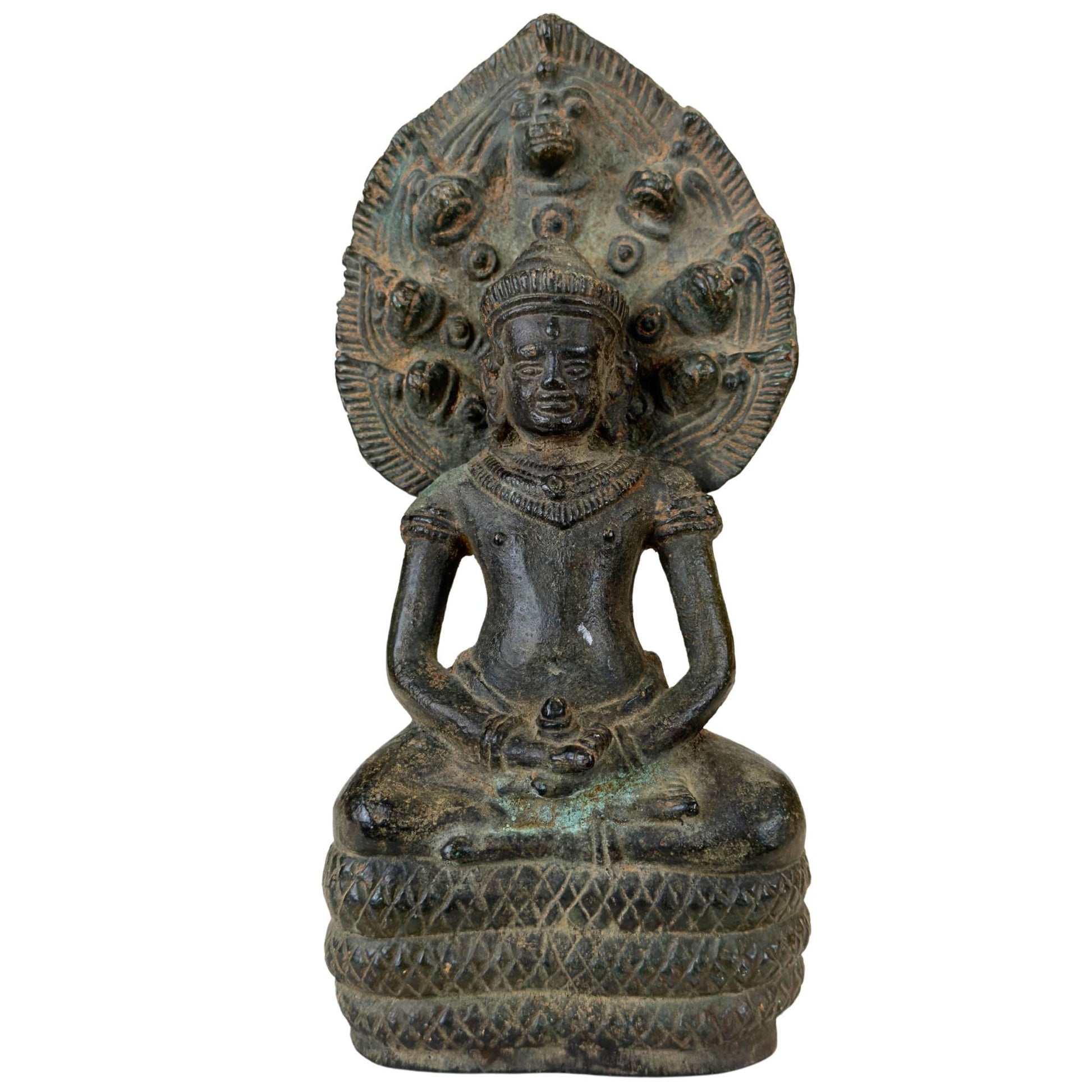 Antique bronze Khmer-style Buddha statue under the Naga hood.