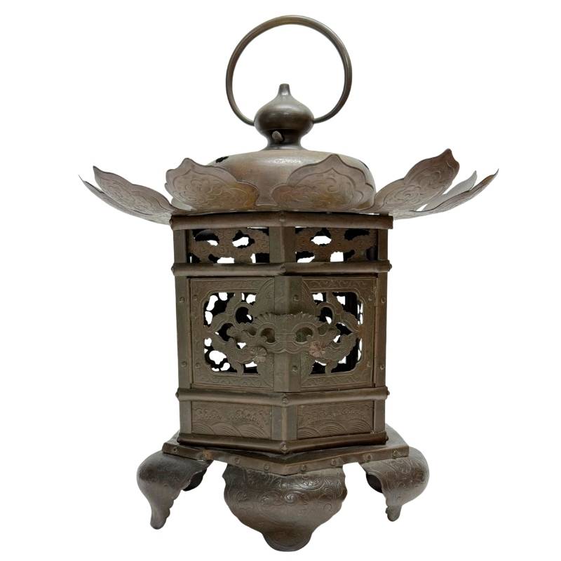 Antique Oriental bronze temple lantern with openwork panels, lotus-shaped crown, and old dark patina