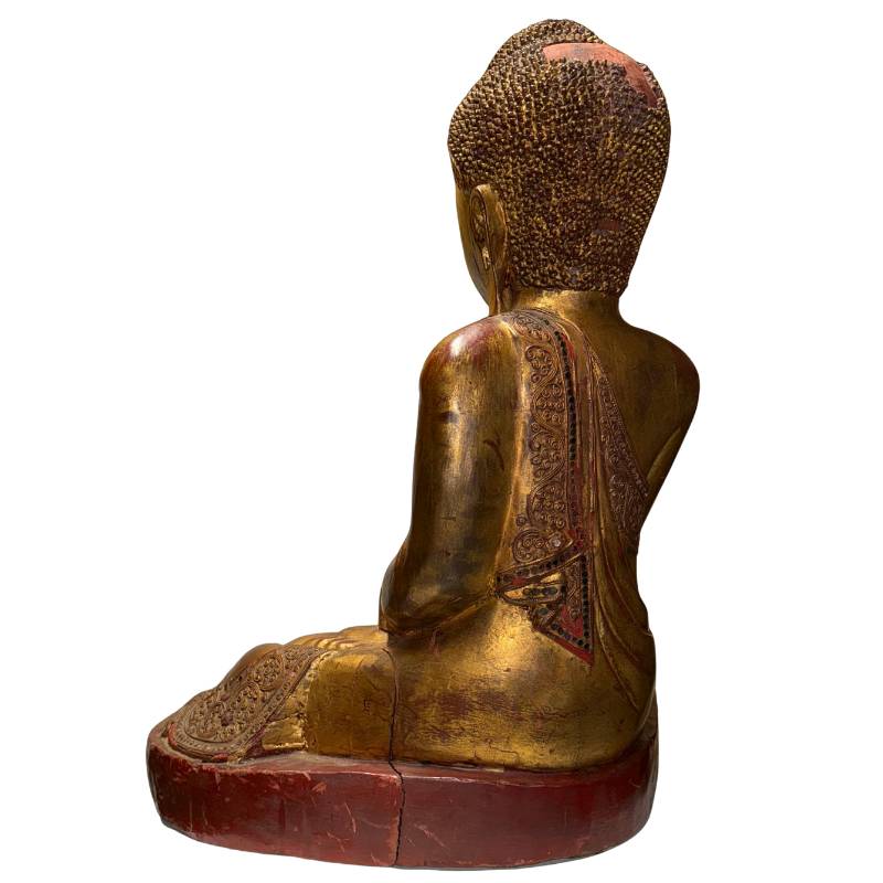 Antique temple Buddha from Burma with gold-colored gilding and red underlayer