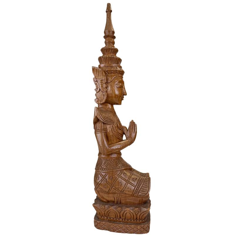 Antique Thai temple guardian wood carving with fine details