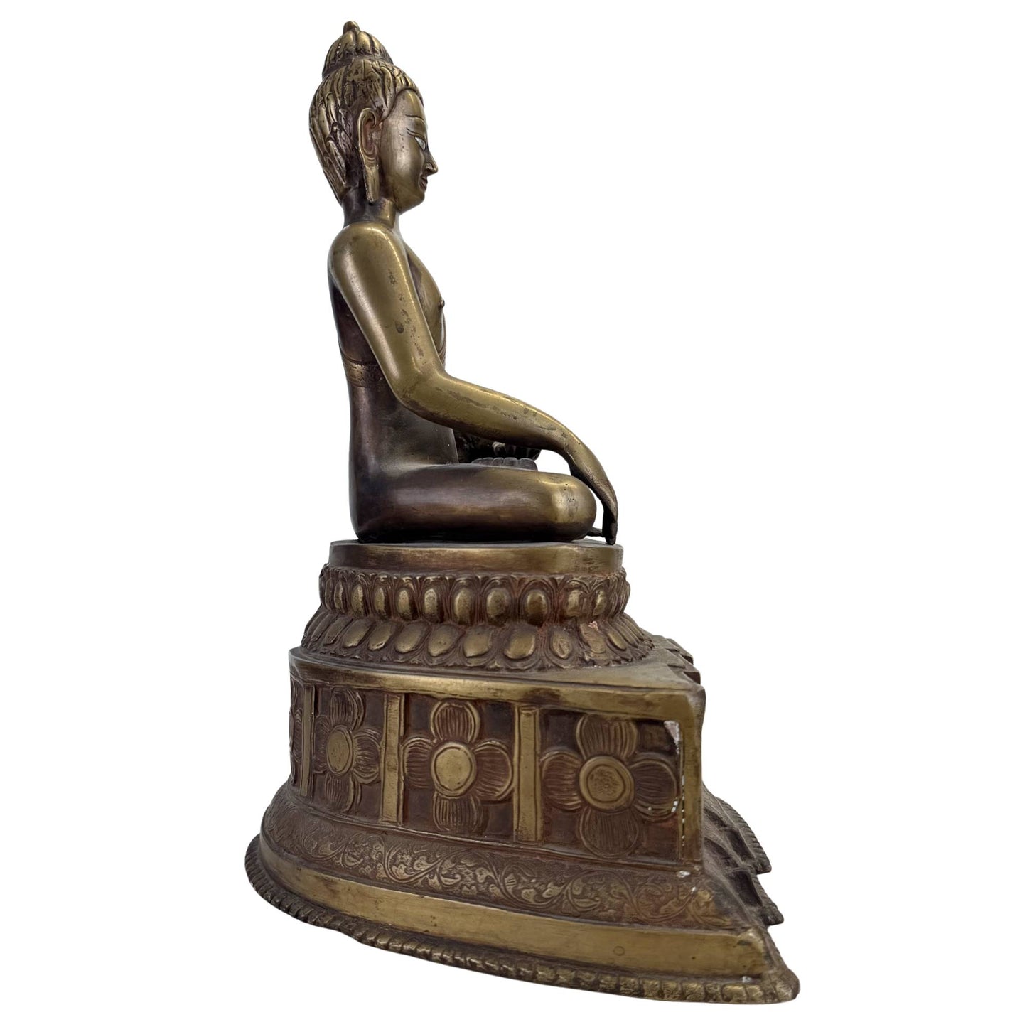 Detail of antique Tibetan Buddha with original silver-inlaid eyes and archaic expression