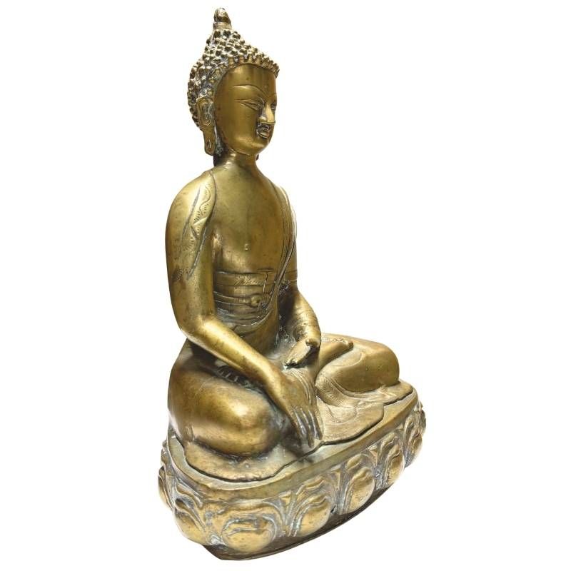 Antique fire-gilded Buddha statue on a lotus base with a classic shape