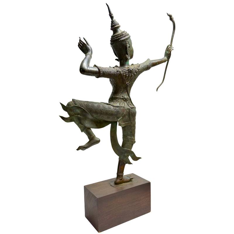 Antique Thai bronze figure with a dynamic pose and rich ornaments