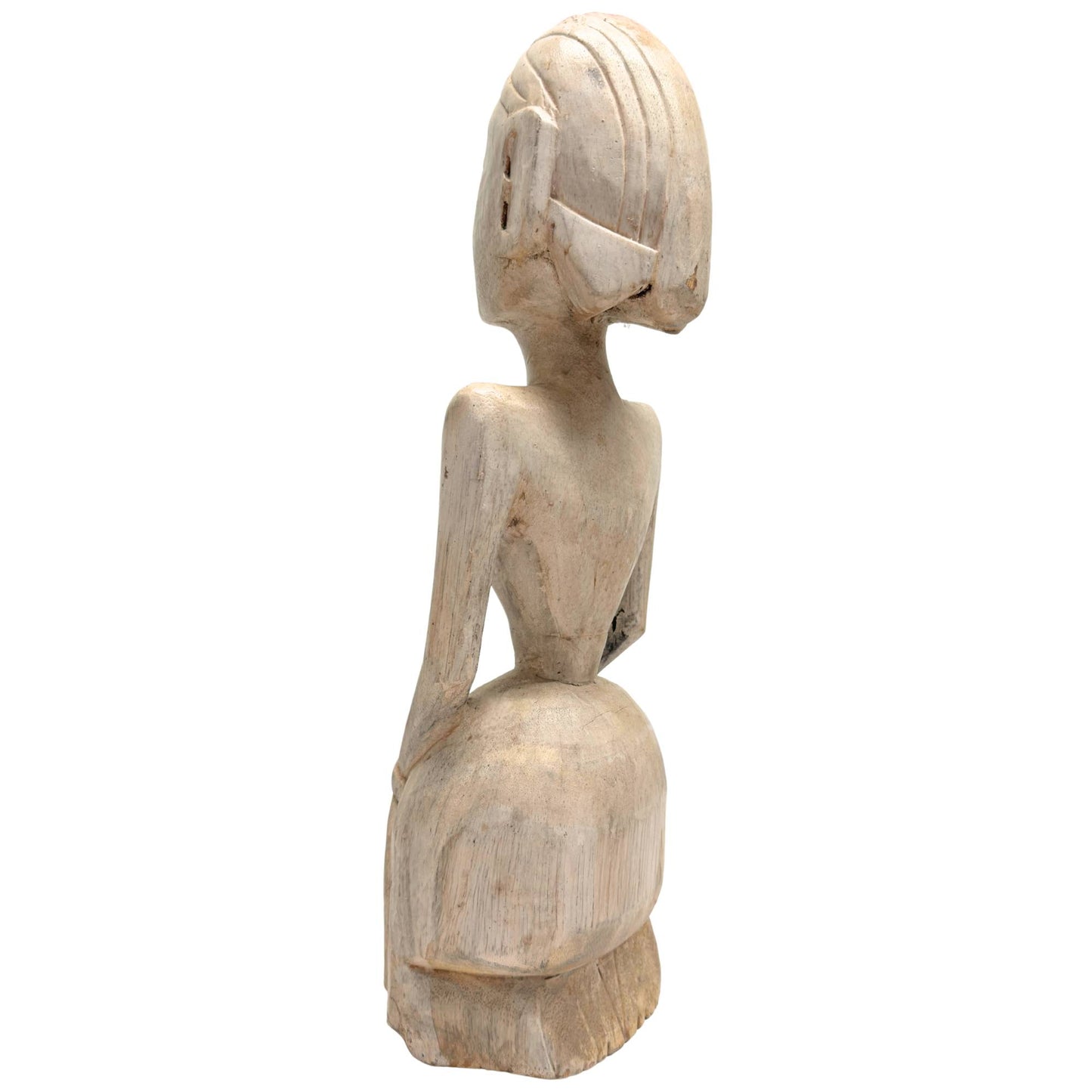 Detail of side view of tribal statue with natural erosion and patina