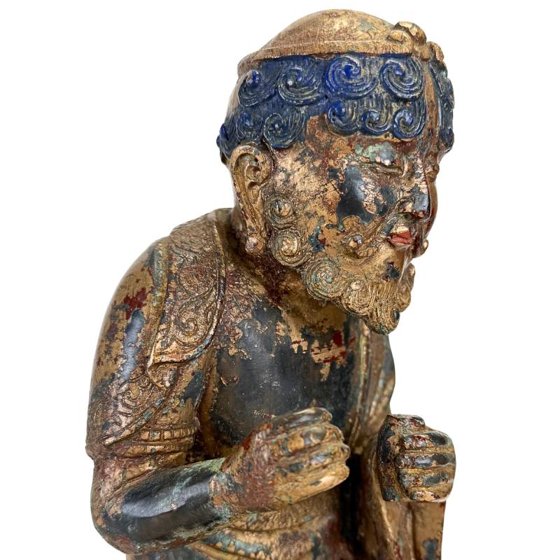 Arhat figure on a buffalo in bronze from the Himalayan tradition