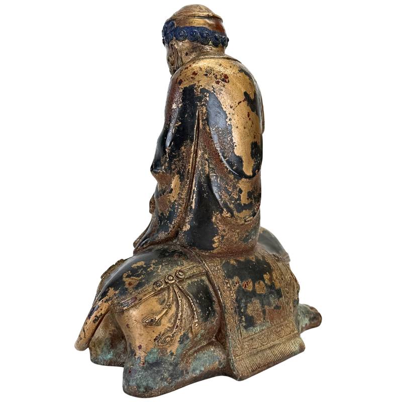 Arhat on Dano animal in gilded bronze Himalayan statue