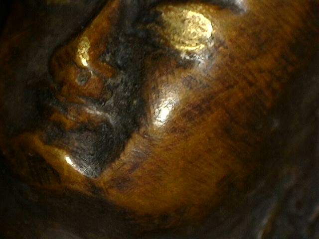 Microscope image of authentic patina on Himalayan bronze Buddha with Dhyana Mudra