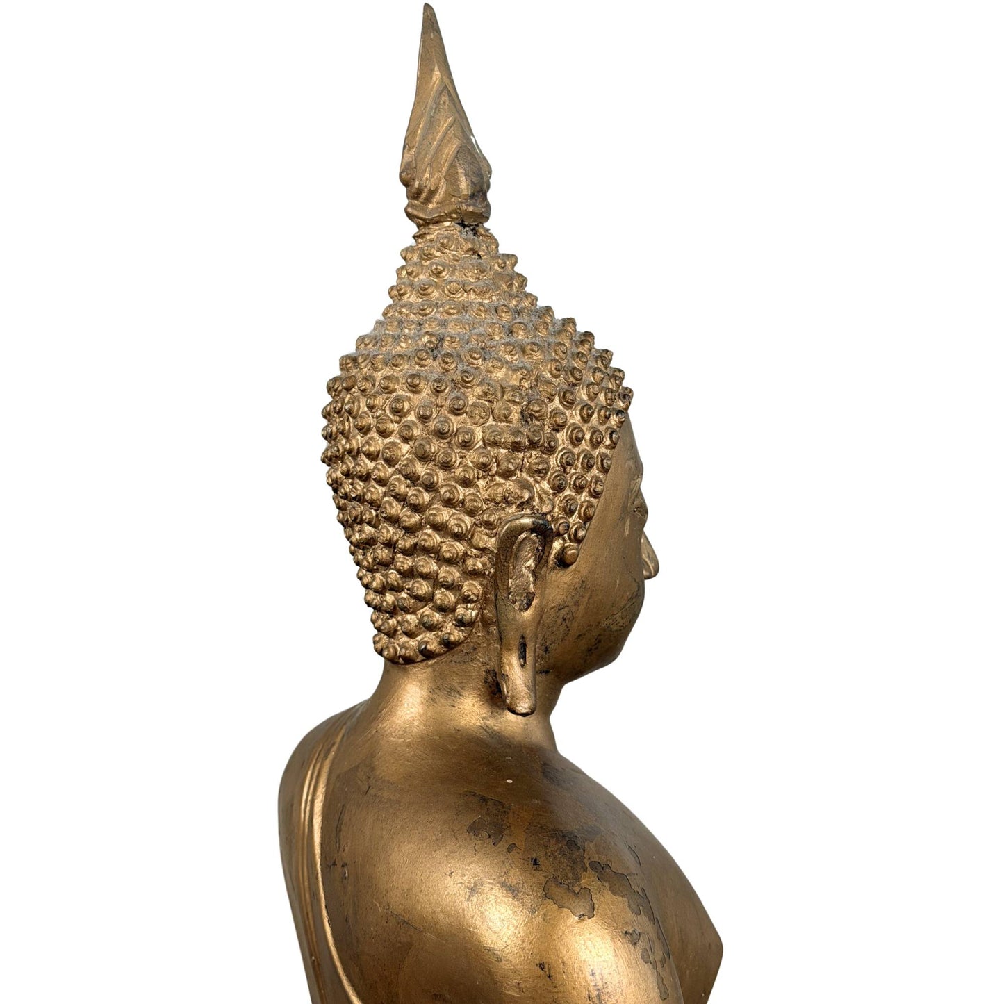 Authentic Thai bronze Buddha statue with a decorative temple appearance