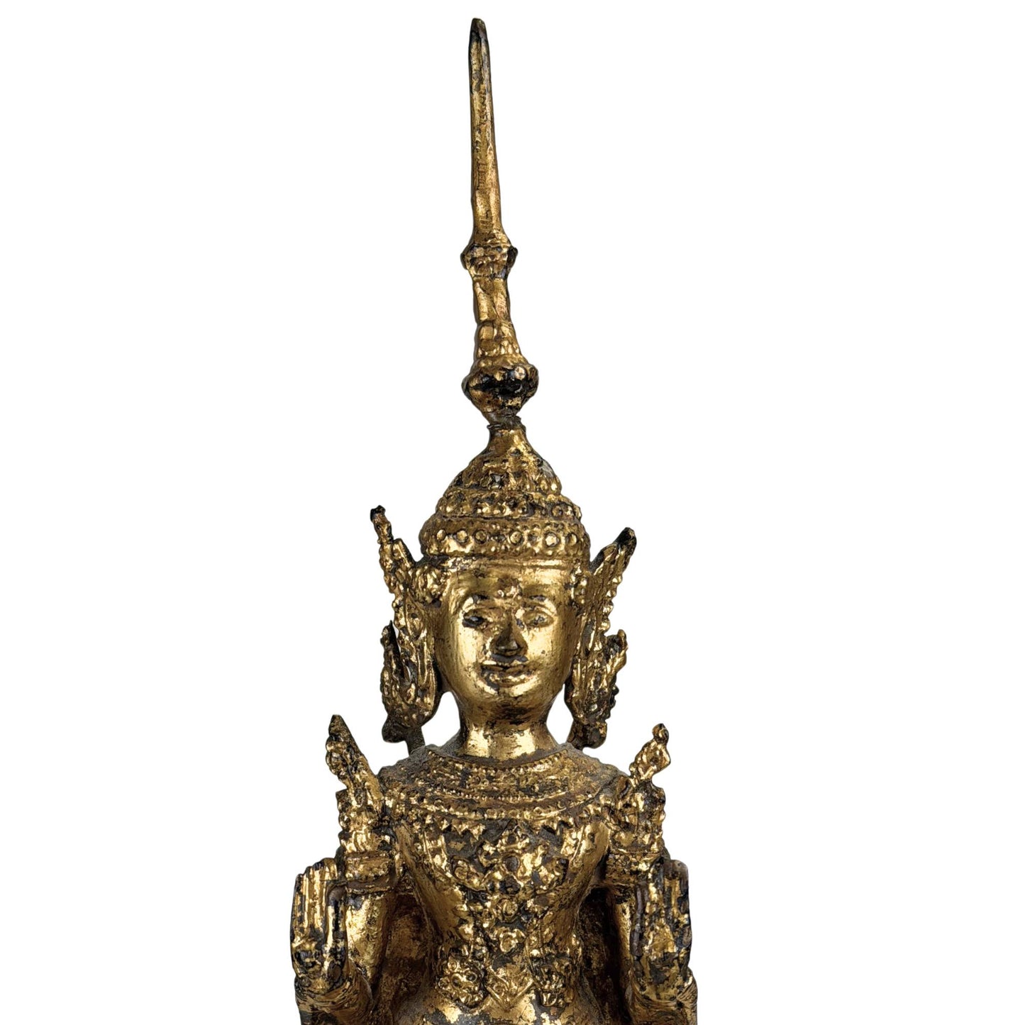 Asian Buddha statue with a serene spiritual aura and old gold patina