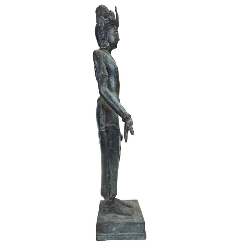 Asian bronze statue of a spiritual guardian with a slender posture