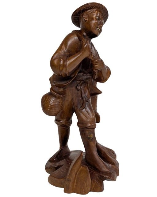 Asian art wooden fisherman with expressive facial features