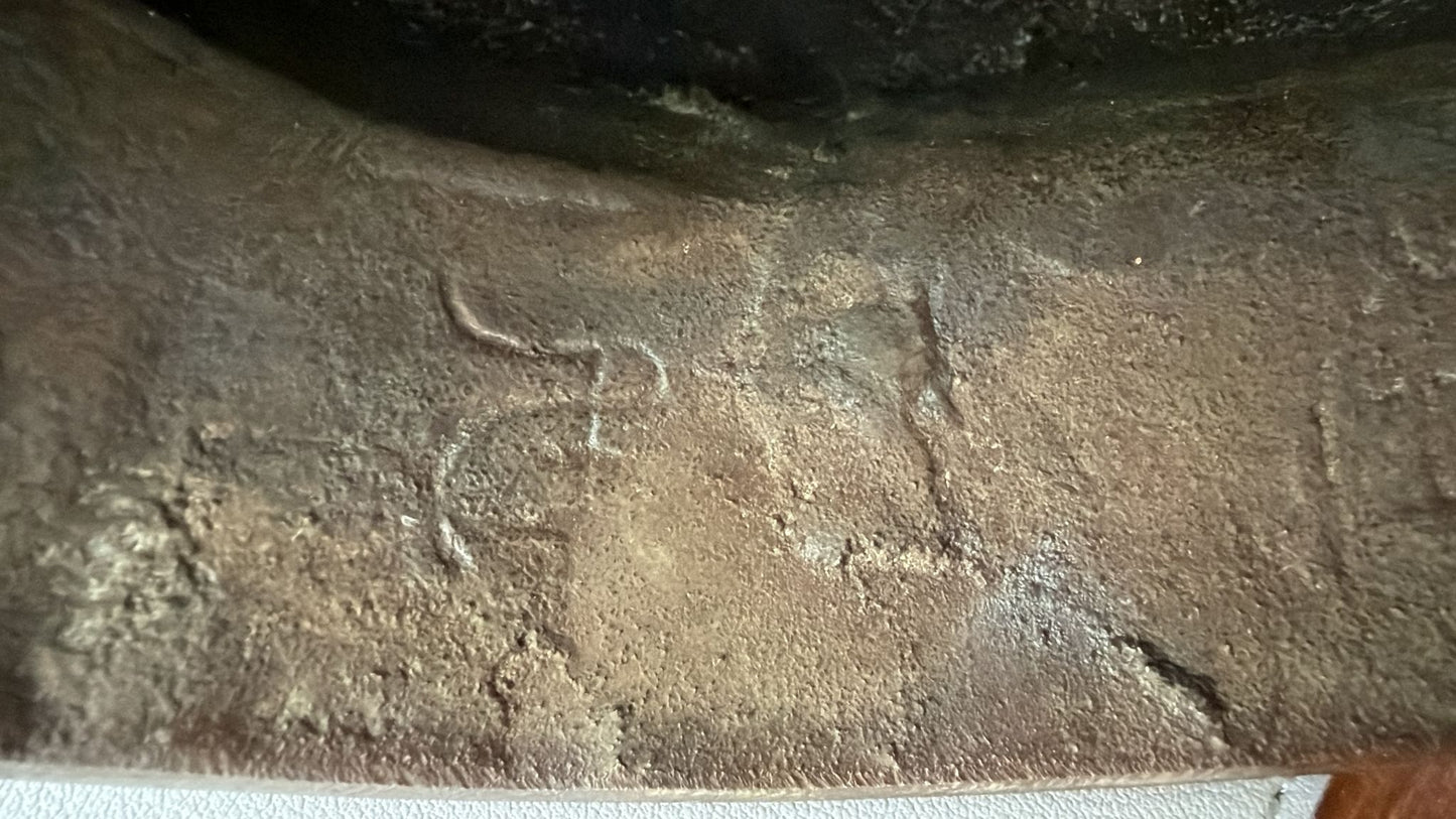 Old Buddha with internal markings.