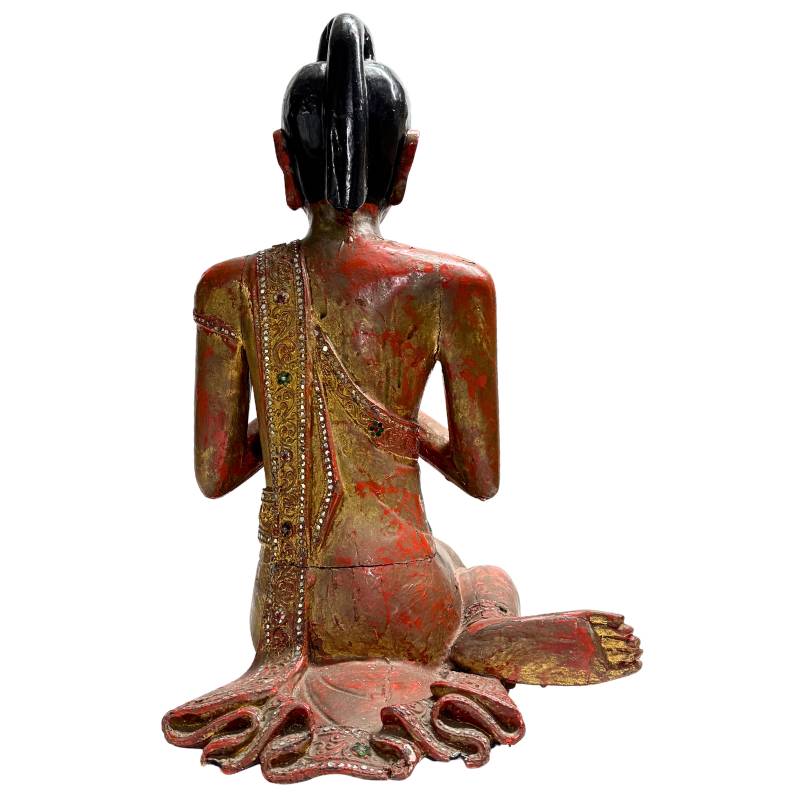 Burmese wooden statue with aged lacquer surface
