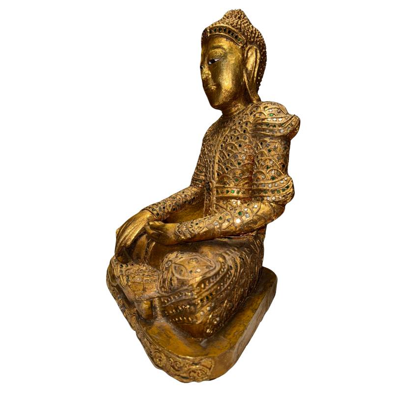 Burmese devotional Buddha statue with gold-colored decoration and classic seated posture
