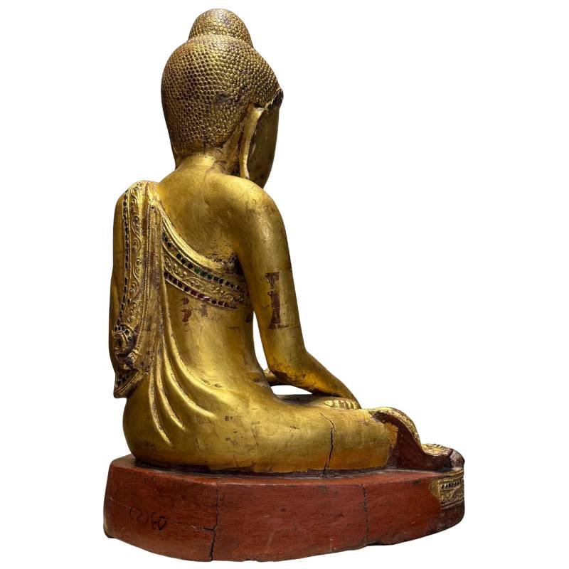 Burmese Buddha with mirrored glass details and traditional Mandalay style