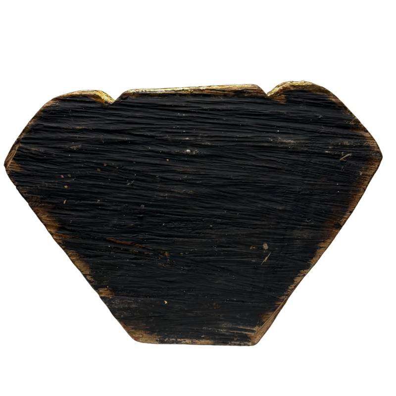 Bottom of antique Burmese wooden Buddha statue with aged wood grain and dark finish