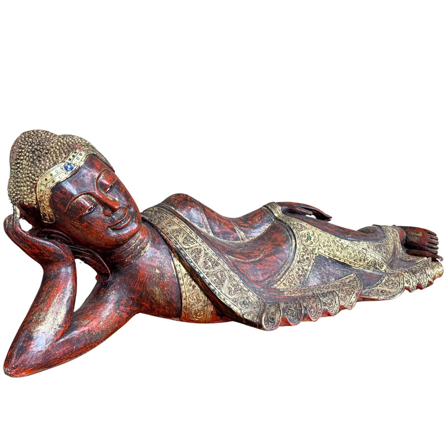 Angled front view of the large Burmese Buddha statue with glass inlays and gold leaf