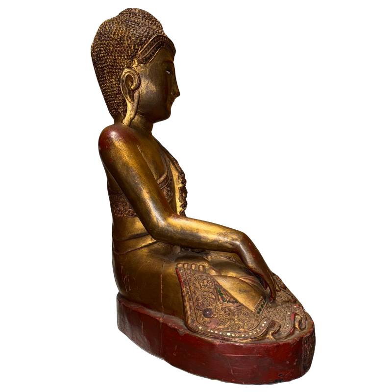 Burmese Mandalay Buddha with a peaceful temple appearance and gold-colored finish