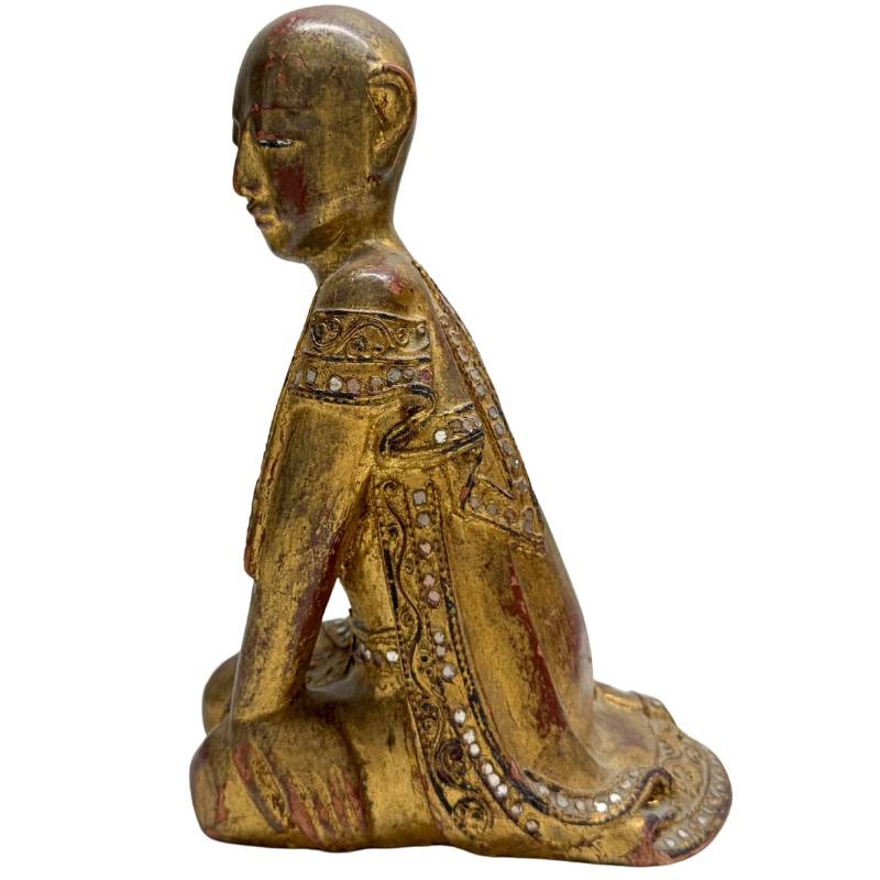 Antique Buddhist statue of a kneeling monk in devotion, Mandalay style.