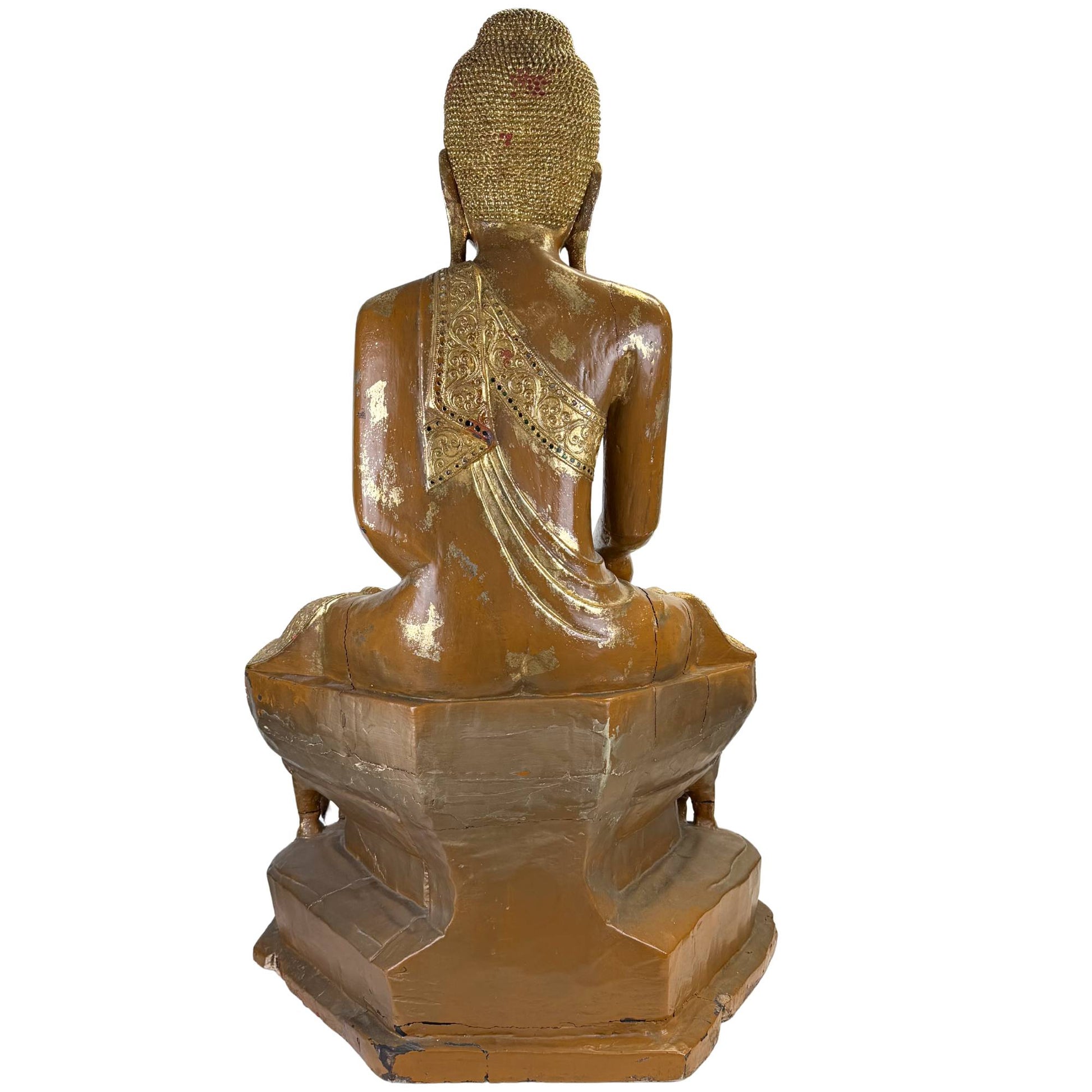 Back of antique Burmese Buddha with golden hair curls, red pigment residue, and old lacquer wear.
