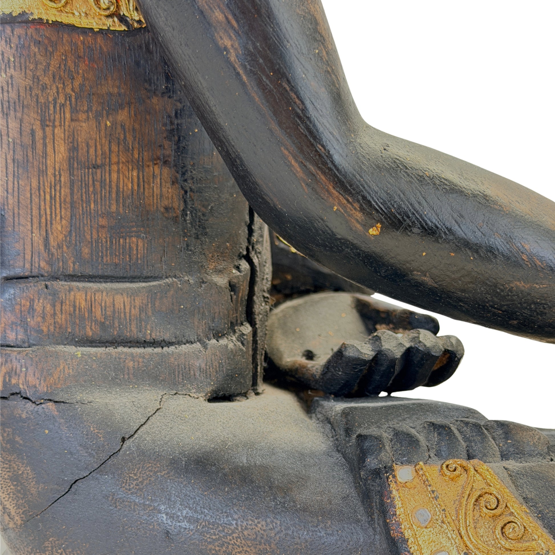 Condition detail showing age cracks and wear in the wooden Buddha sculpture