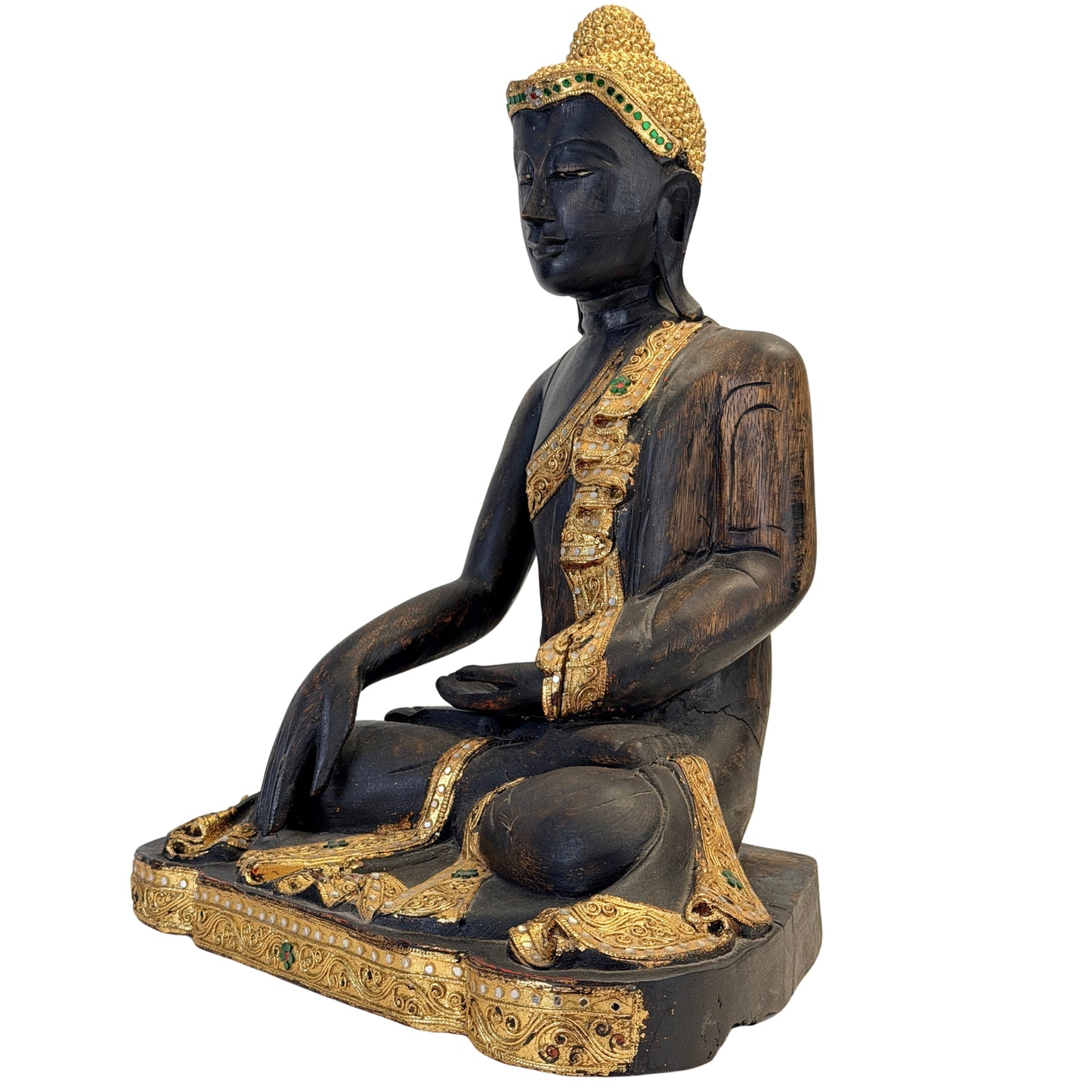 Three-quarter front view of the antique Burmese Buddha with richly gilded robe
