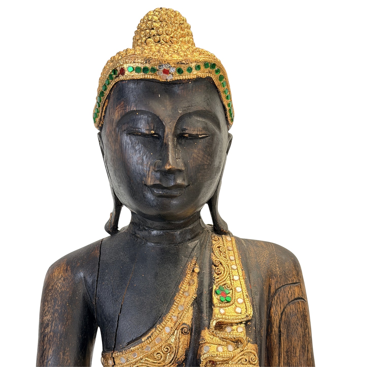 Detail of the serene face and gilded ushnisha of the Burmese Buddha