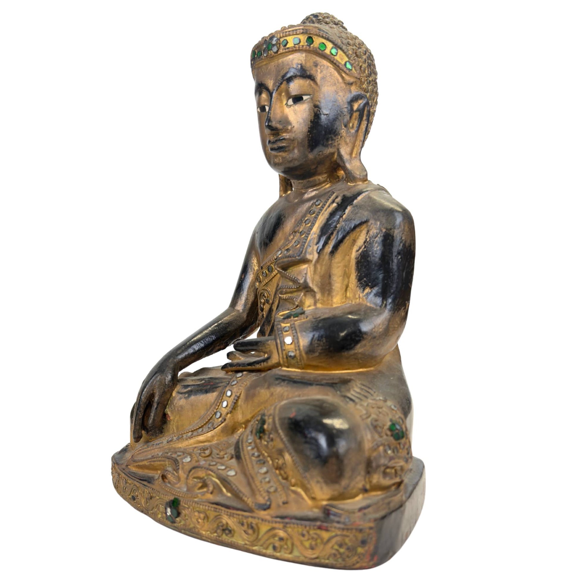 Burmese Buddha with traditional lacquer finish and glass inlay