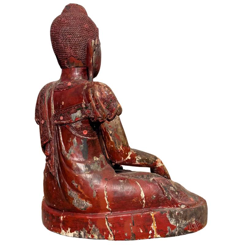 Burmese Buddha sculpture with remnants of red lacquer
