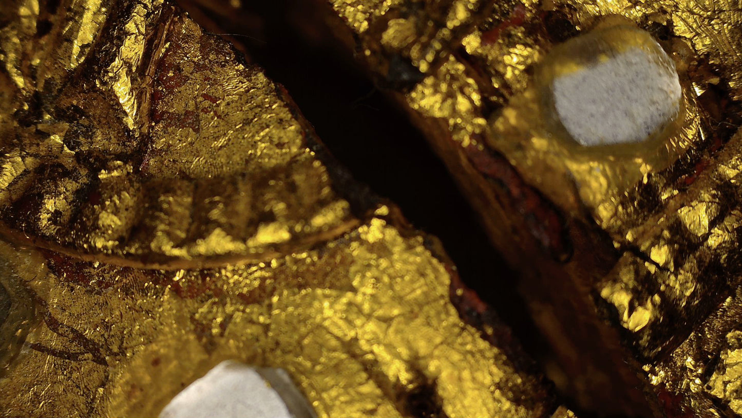 Microscope detail of old gilding and mirror-glass inlay