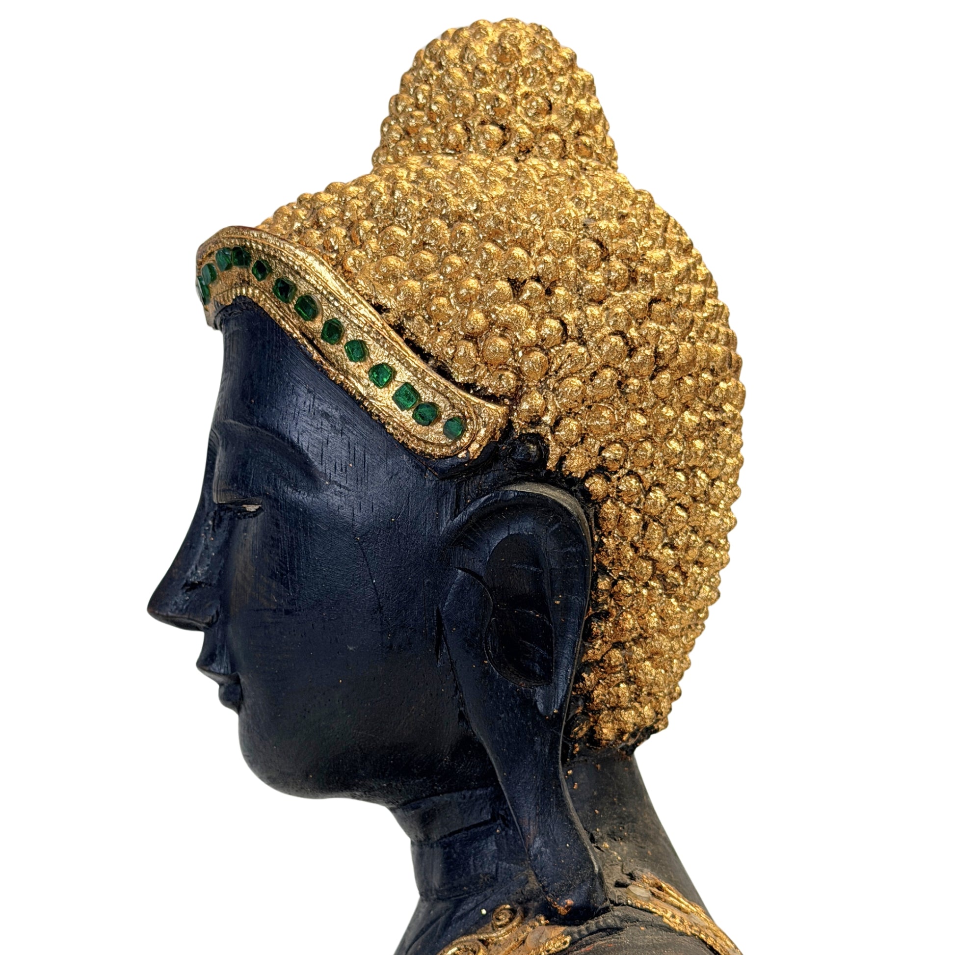 Detail of the profile and gilded ushnisha of the Burmese Buddha