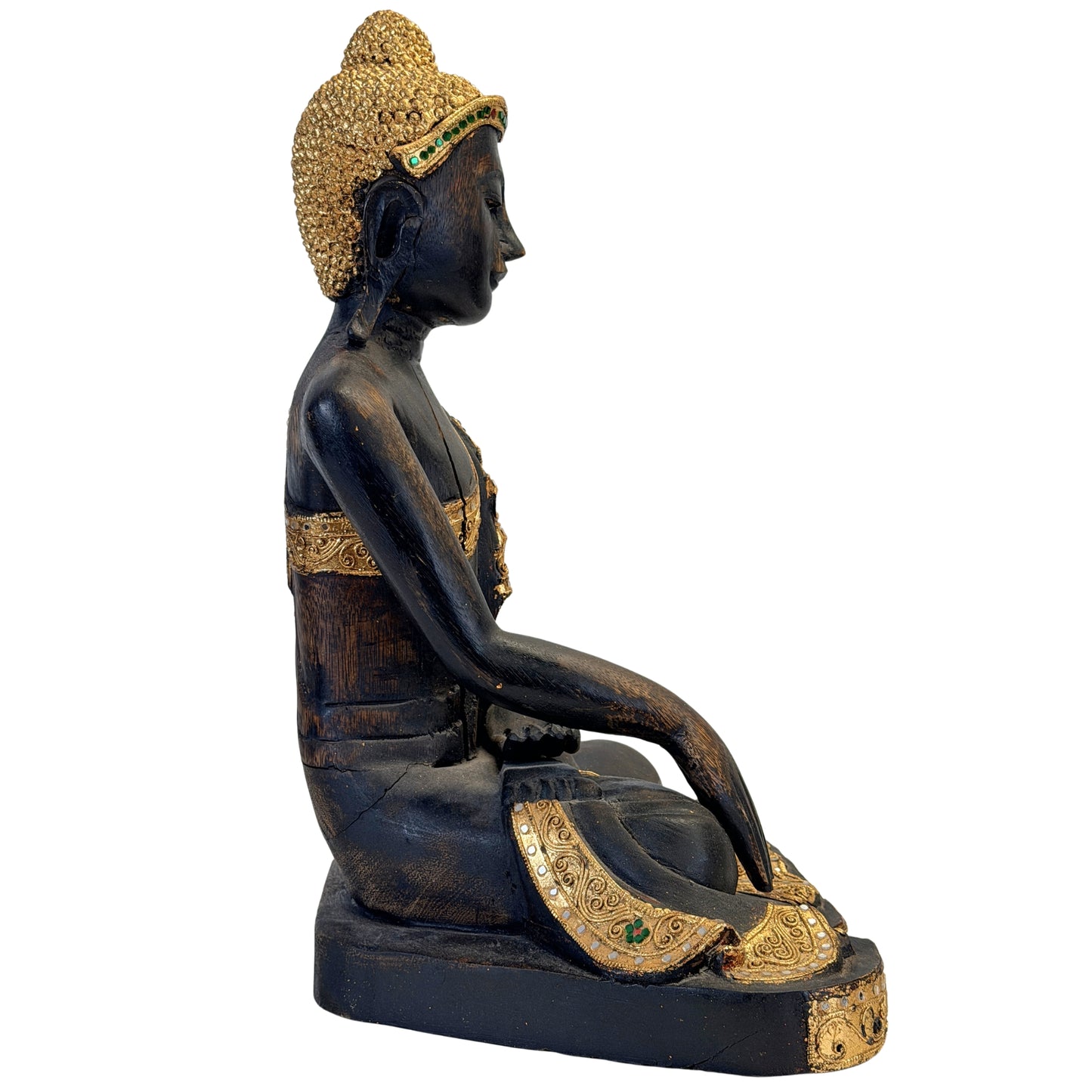 Detail of the gilded hair and green mirror-glass inlay of the Buddha
